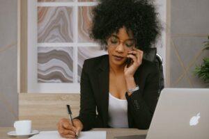 woman in suit on the phone