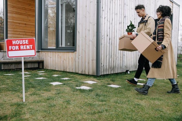 tenant-holding-moving-boxes-in-th-process-of-movin-into-their-rental-property